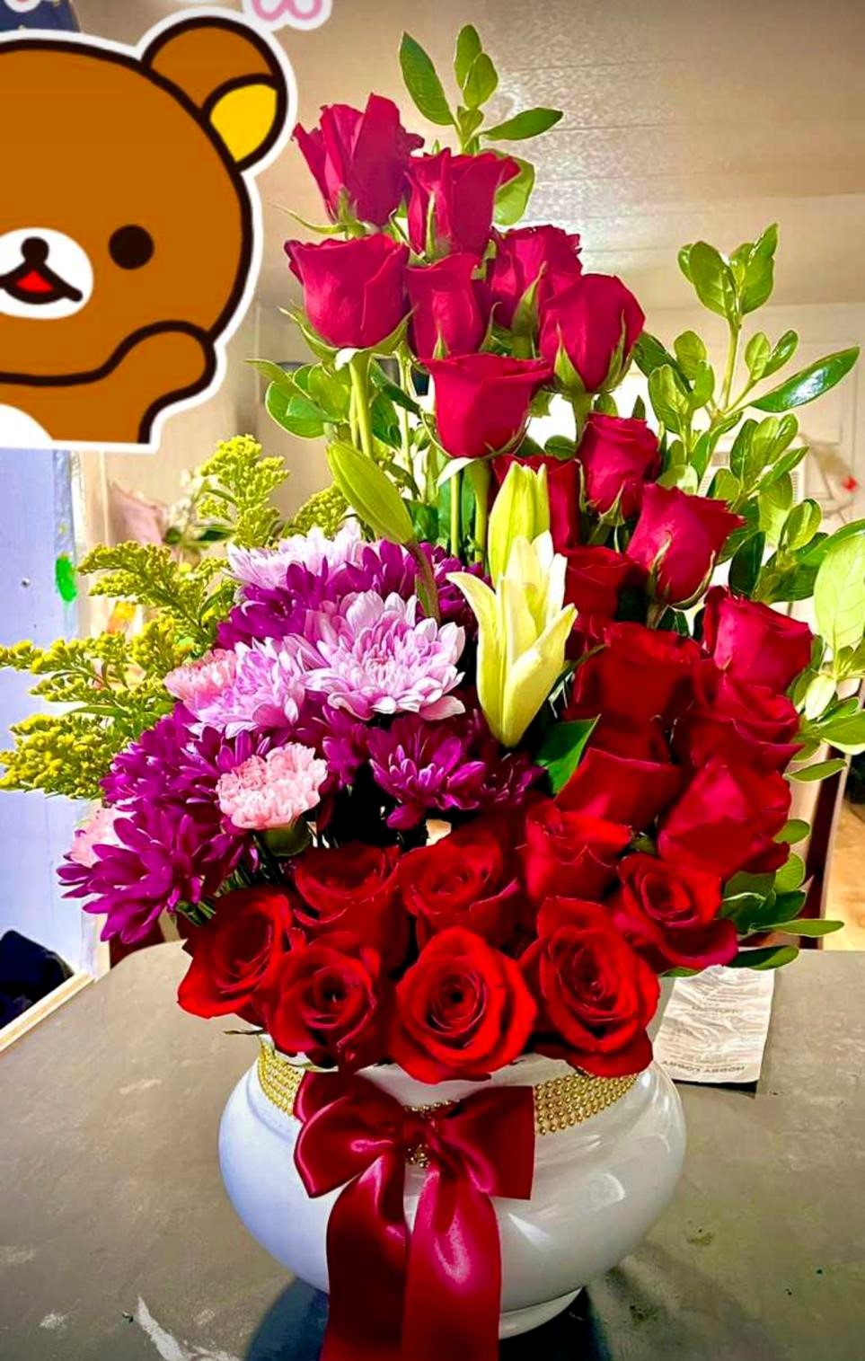 luxurious-red-roses-and-purple-flowers-arrangement-with-bow