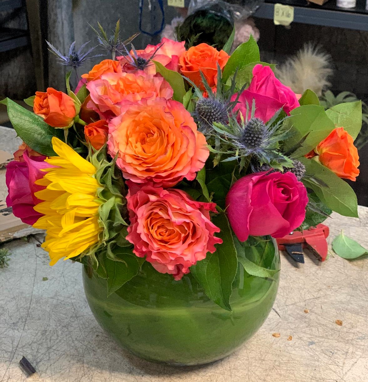 vibrant-floral-arrangement-with-roses-sunflowers-and-thistles